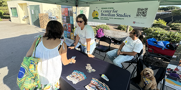 woman and man tabling at event