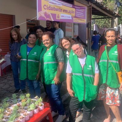 group of volunteers at market selling small plants