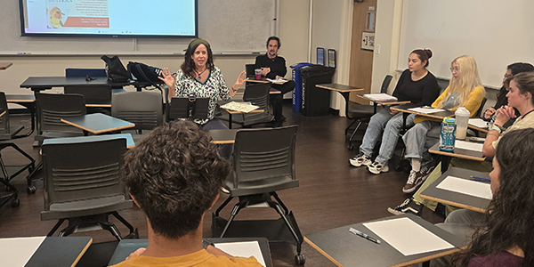 students listen to author Silvia Nicolatto