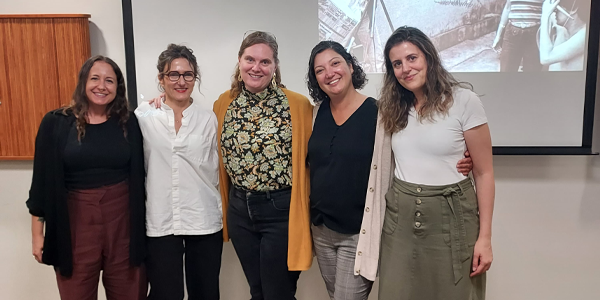 group of people pose after lecture